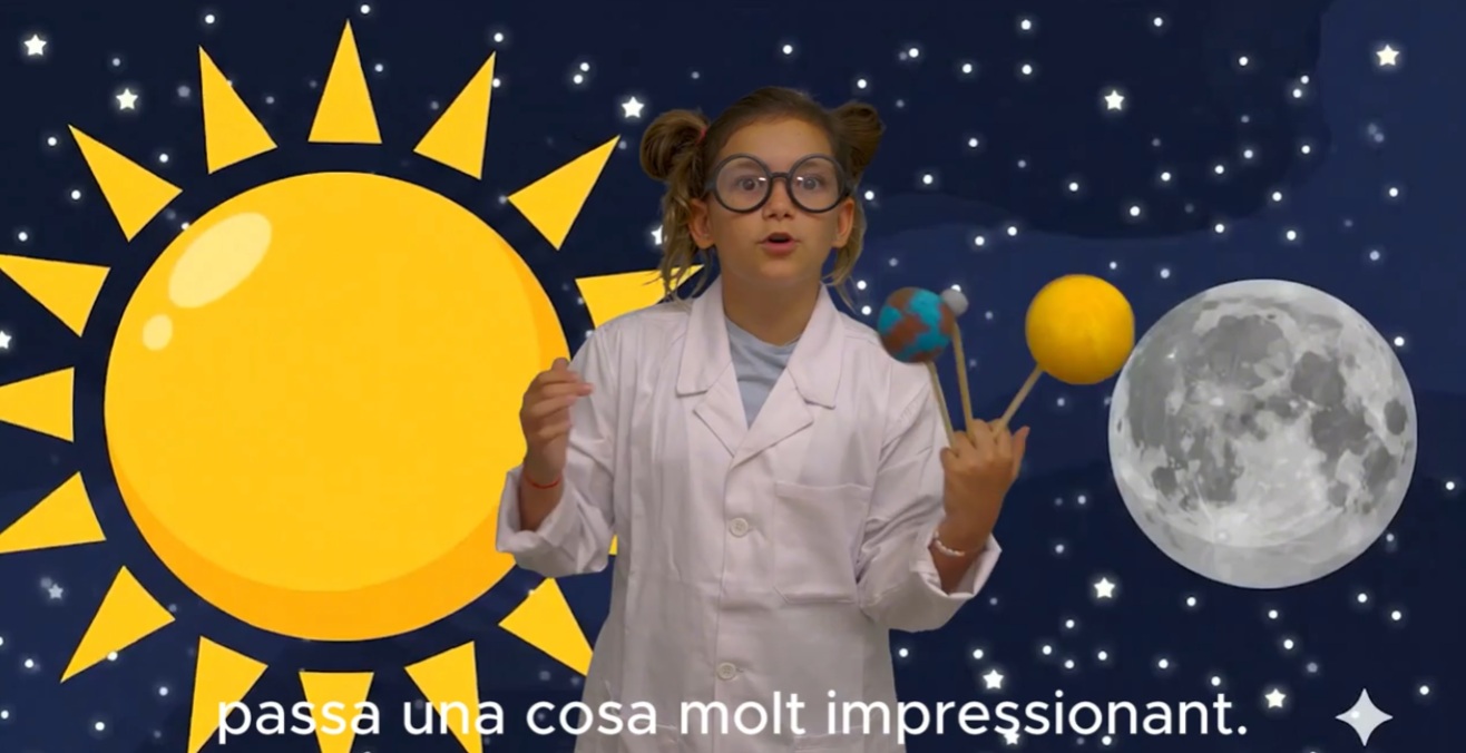 Una nina explica per què es produeix un eclipsi